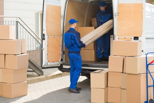 Professional house removalists packing items in Westminster