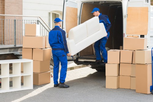 Man with a van in Westminster loading boxes for a local move