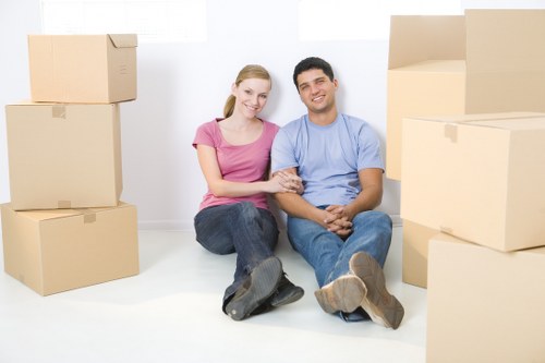 Packed moving boxes and household items ready for loading in Westminster