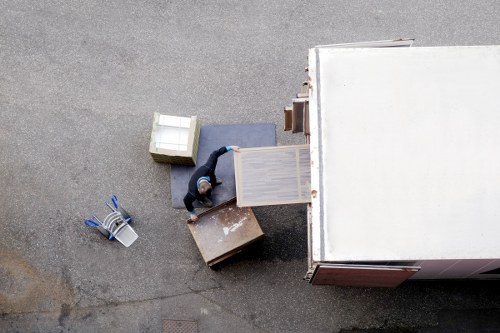Professional movers packing furniture for a Westminster flat move