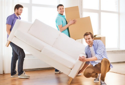 Removal team loading furniture for a Westminster home move