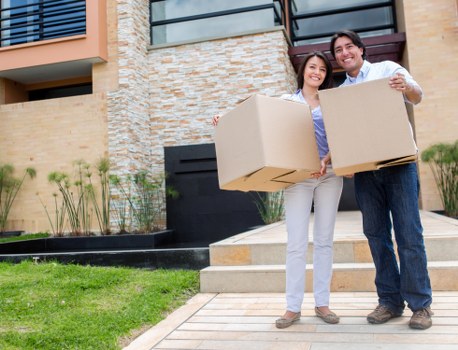 Professional movers carrying boxes in Westminster